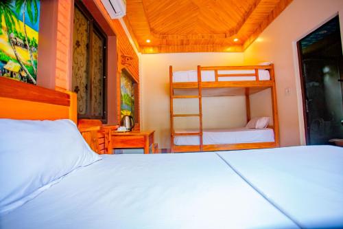 Ένα ή περισσότερα κρεβάτια σε δωμάτιο στο Hillside View Bungalow Homestay