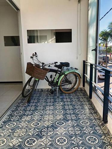 a bike parked on the side of a building at Increíble departamento en malecón frente al mar in Mazatlán