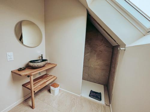 a bathroom with a sink and a mirror at Domaine du Mimosa in Perros-Guirec