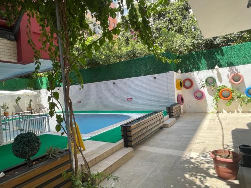 a swimming pool in the backyard of a house at Twin Apart Hotel in Alanya