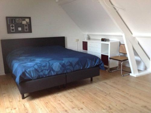 Ένα ή περισσότερα κρεβάτια σε δωμάτιο στο Fijne studio op het Zuid