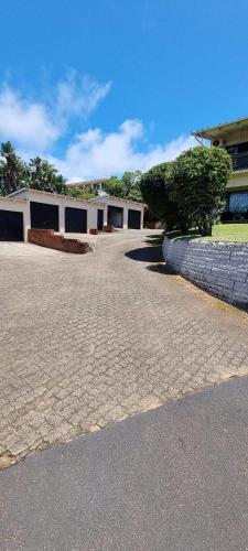 an empty parking lot in front of a building at Umtentweni, Seaview Unit Alpero in Port Shepstone
