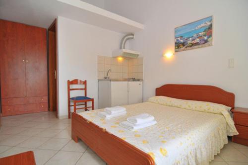 Ένα ή περισσότερα κρεβάτια σε δωμάτιο στο Villa Iris