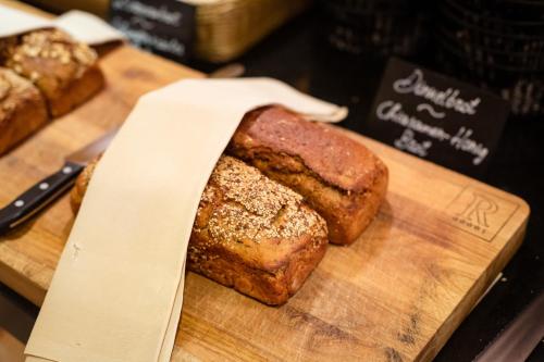 a loaf of bread sitting on a cutting board at Wellness & Naturresort Reischlhof in Wegscheid