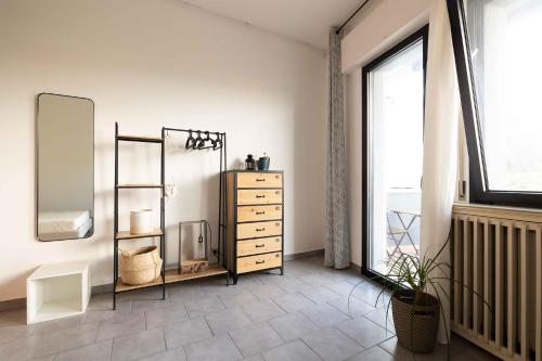 a room with a dresser and a mirror at Spazio Ancora appartamento a 500 m. dal mare in Rimini
