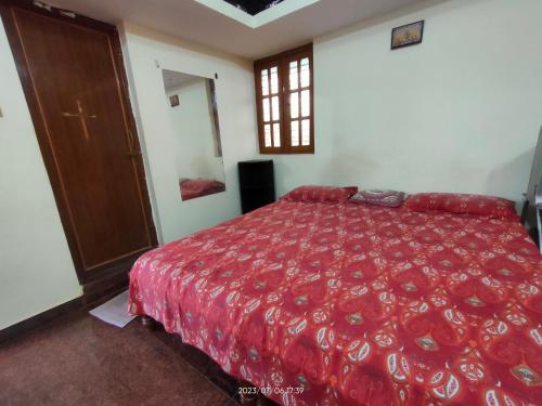 Postel nebo postele na pokoji v ubytování Akshay Sweet Home Stay