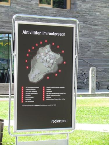 a sign for a walk in a park at Laax with indoor and outside pool, sauna, 200 Meter to Ski lift , Fitnessroom, Tennis Place, Joyroom, Parkstadion Reserve in Laax