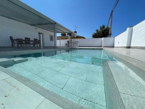 a swimming pool with blue water in a house at Casa Miamar I in Campano