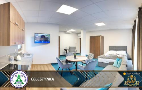 a room with a bed and a table and chairs at Celestynka in Rymanów-Zdrój