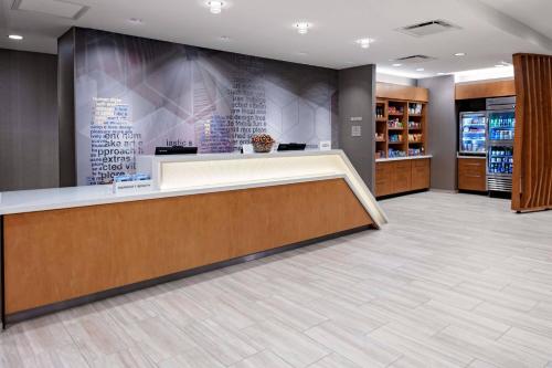 a lobby of a store with a cashier counter at SpringHill Suites by Marriott Kansas City Plaza in Kansas City