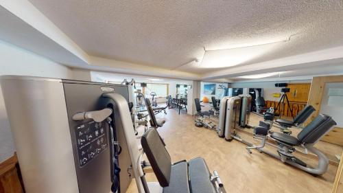 a gym with a bunch of treadmills and machines at Wellness Aparthotel Panorama Alpin - Ferienwohnungen Jerzens im Pitztal in Jerzens