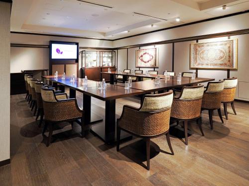 a large conference room with a long table and chairs at Dhawa Yura Kyoto in Kyoto