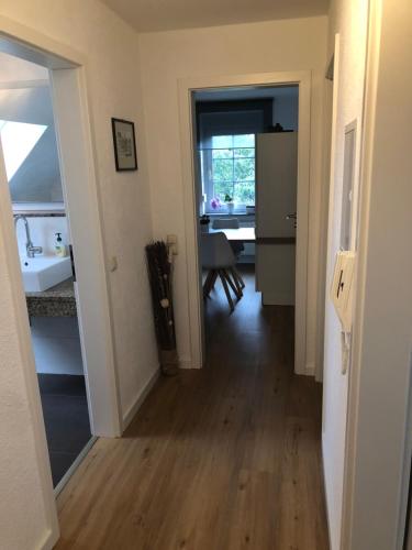 a hallway with a kitchen and a dining room at Ferienwohnung Giese in Bleckede