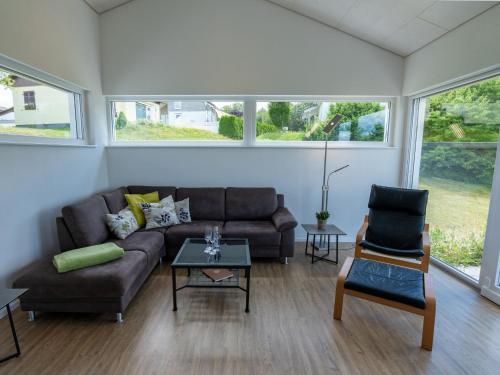 a living room with a couch and two chairs at Holiday Home Saarland by Interhome in Dittishausen