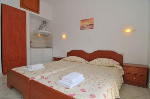 Ένα ή περισσότερα κρεβάτια σε δωμάτιο στο Villa Iris