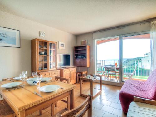 a living room with a table and a couch at Apartment Les Indes Galantes by Interhome in Cap d'Agde