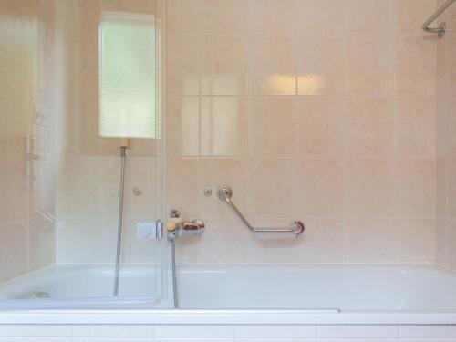 a shower with a glass door in a bathroom at Apartment Les Crêtes 1-3 by Interhome in Veysonnaz