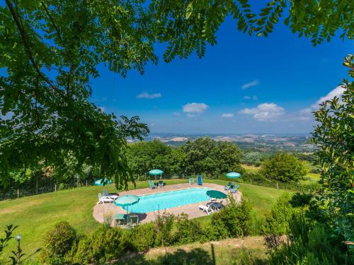 an image of a swimming pool in a grassy field at Holiday Home Poggio al Colle by Interhome in San Vivaldo