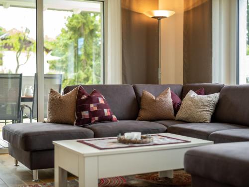 a living room with a couch and a coffee table at Holiday Home Ambiente by Interhome in Dittishausen