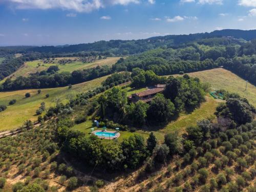 an aerial view of a farm with a pool in a field at Holiday Home Poggio al Colle by Interhome in San Vivaldo