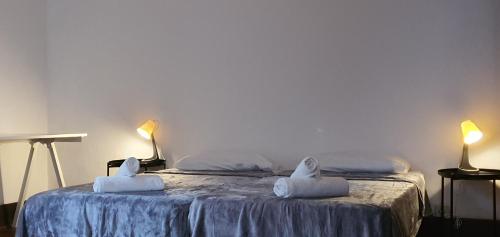 a bedroom with a bed with towels on it at Casa Andrea in Las Palmas de Gran Canaria