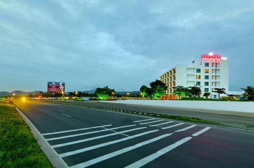 an empty street with a building in the background at Effotel by Sayaji Sarola in Bhor