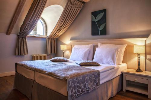 Postel nebo postele na pokoji v ubytování Boutique Hotel Nautilus