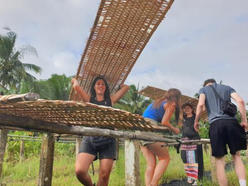 a group of people standing under a bridge at WELKOM INN in Can Tho