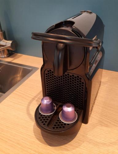a coffee maker sitting on a counter next to a sink at Studio Flevo Batavia in Lelystad