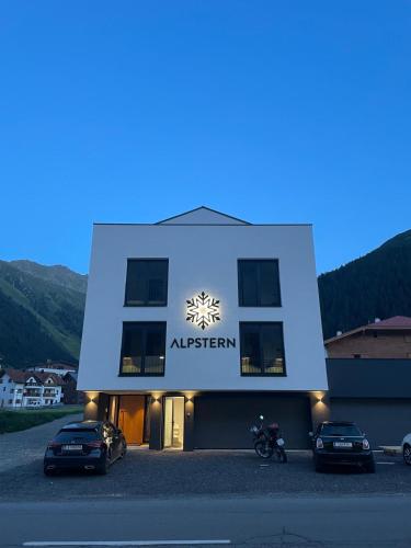 a building with a sign on the side of it at Alpstern in Galtür