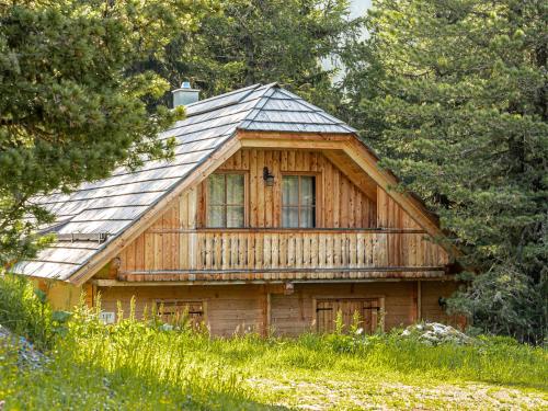 a wooden cabin with a gambrel roof at Cozy Alpin-Hütte Haus Murmeltier by S4Y in Turracher Hohe
