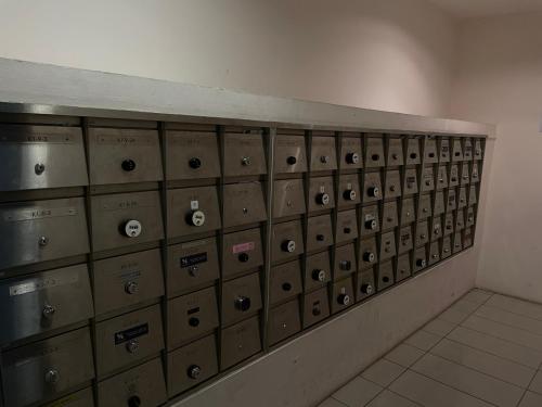 a row of lockers in a room at Chill Studio Wi-Fi & Netflix 5min From Airport At Aeropod Sovo in Kota Kinabalu