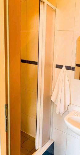 a bathroom with a shower and a sink at Jahodná in Košice
