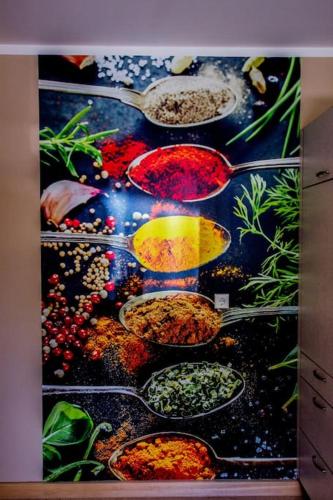 a poster with different types of food in bowls at Ferienwohnung in Feldkirchen Dagmar und Christian! in Feldkirchen in Kärnten