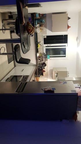 a kitchen with a counter top in a room at Chez Riz in Arles