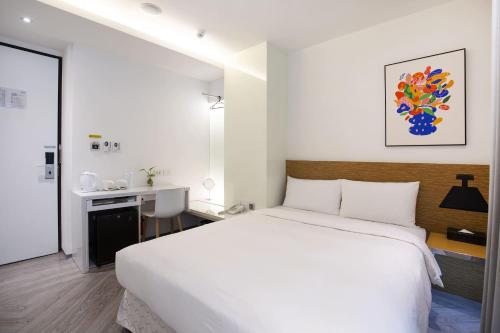 Ein Bett oder Betten in einem Zimmer der Unterkunft CityInn Hotel Plus - Ximending Branch