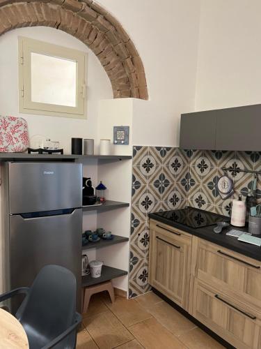 a kitchen with a sink and a counter top at Appartamento Vaticano in San Vincenzo