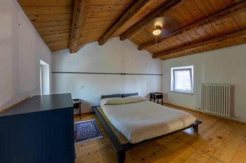 Ένα ή περισσότερα κρεβάτια σε δωμάτιο στο Relais Castel d'Emilio - Casa BLU