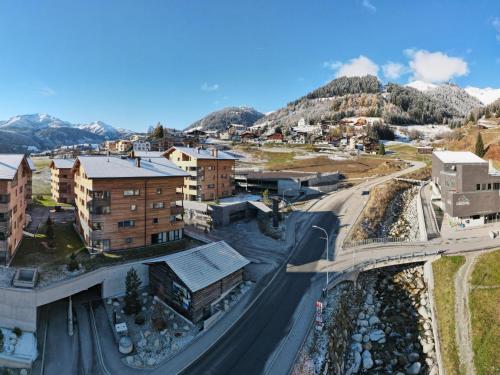 an aerial view of a city with a mountain at Apartment Catrina 3-Zimmer Premium Apartment by Interhome in Disentis