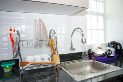 a kitchen counter with a sink and a sink at Kelly homes in Naivasha in Naivasha