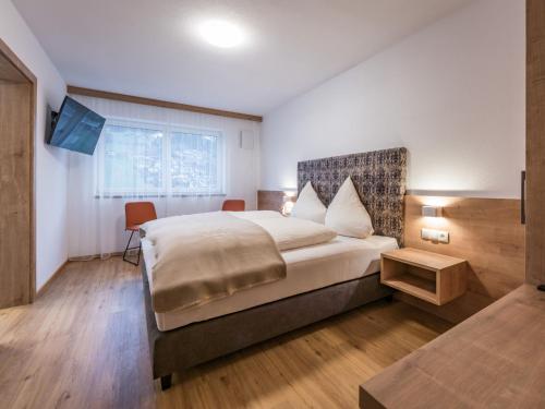 Postel nebo postele na pokoji v ubytování Apartment Montec Apart 2 by Interhome