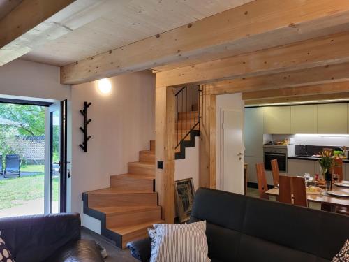 a living room with a staircase in a house at Holiday Home Cà dal Leo by Interhome in Bignasco