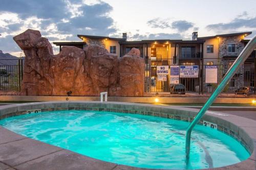 a swimming pool in front of a resort at Sage Creek at Moab Luxury Condo B in Moab