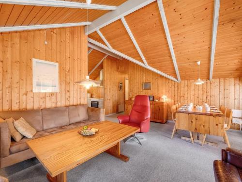 een woonkamer met een bank en een tafel bij Holiday Home Clea - 800m from the sea in Western Jutland by Interhome in Vejers Strand