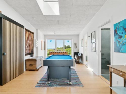 a pool table in the middle of a room at Holiday Home Galia - 500m from the sea in Djursland and Mols by Interhome in Ørby