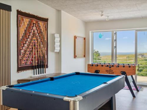 a room with a pool table and a painting at Holiday Home Galia - 500m from the sea in Djursland and Mols by Interhome in Ørby