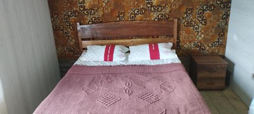 Ένα ή περισσότερα κρεβάτια σε δωμάτιο στο Guesthouse Omalo