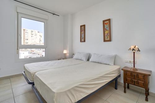 Posteľ alebo postele v izbe v ubytovaní Apartamento primera linea A01