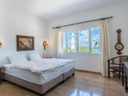 a bedroom with a bed and a window at Holiday Home Las Gaviotas Style & Charm by Interhome in Colonia Sant Jordi