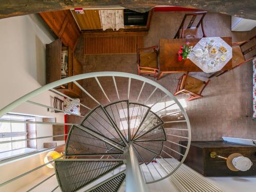 a spiral stair case in a building with a spiral staircase at Apartment Torre 4 by Interhome in Stigliano